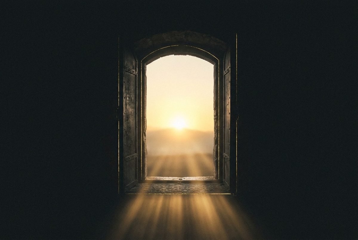 An archway opening onto gold light